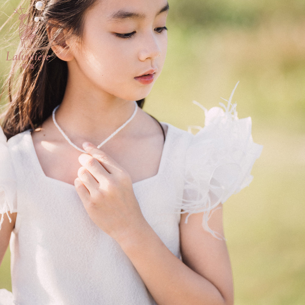 女童白色羽毛高定礼服裙