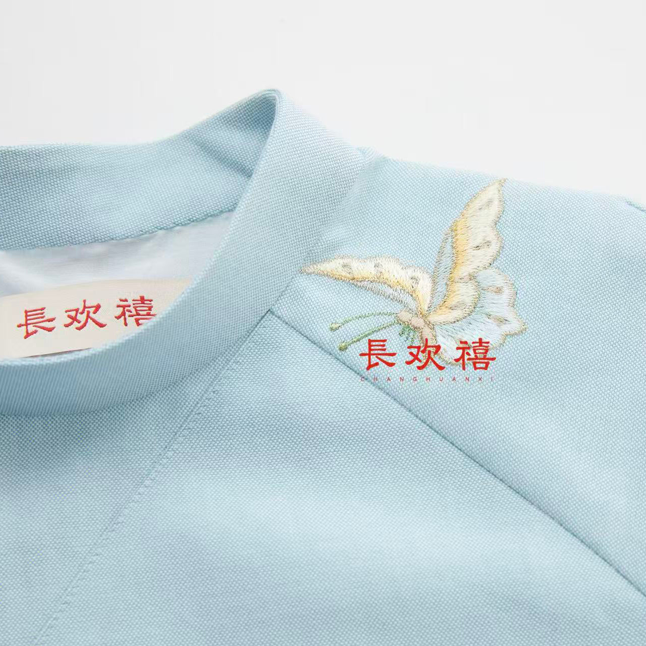 女童浅蓝色"蝶恋花"中式旗袍
