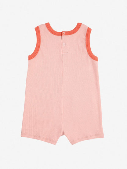 Smiling pink playsuit