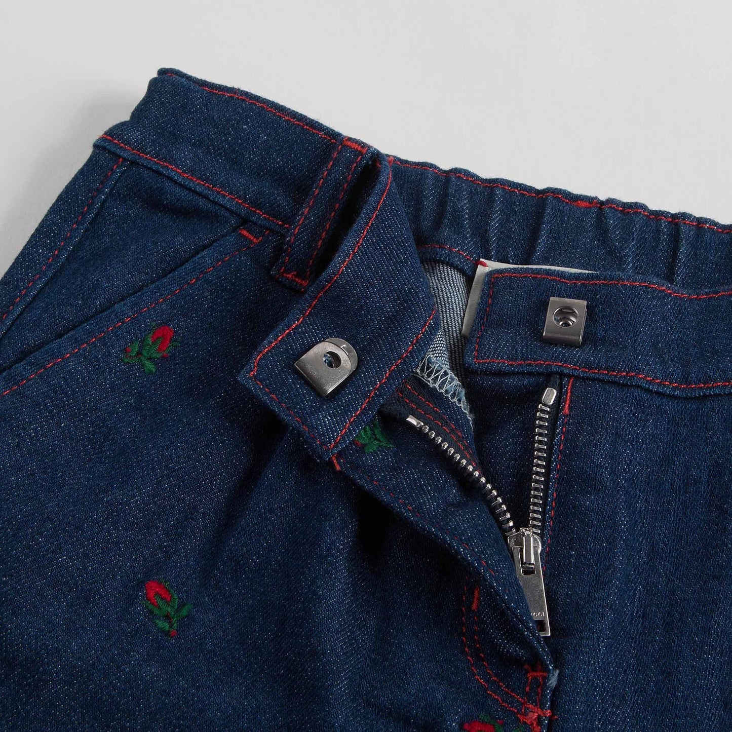Baby Girls Blue Denim Jeans With Red Embroidered Flower Trims
